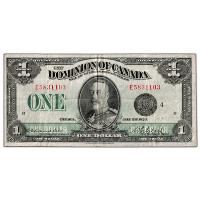 Front side of 1923 Canadian one-dollar bill number 5831103, showing King George V portrait and Black Seal Series E in Fine/Very Fine condition.