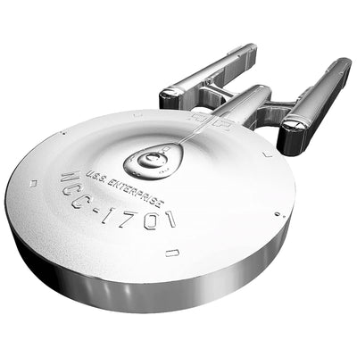 A side-profile view of the 2017 Canadian 100-dollar Star Trek Enterprise shaped silver coin, showcasing its unique dimensional thickness. Struck from 10 ounces of pure silver by the Royal Canadian Mint, this view highlights the plain, smooth coin edge and illustrates how the warp nacelles, secondary hull, and saucer section are engineered out of a single piece of silver metal.