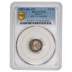Encapsulated 1823 Mexico Mo JM 1/2 Real silver coin graded PCGS F-15. The slab features a PCGS authentication label at the top and showcases the historic Agustín de Iturbide profile portrait on the coin's obverse.