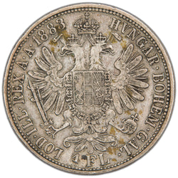 Reverse of an ungraded Austria 1883 Florin (Gulden) silver coin (KM# 2222 / Herinek 479, Serial/SKU: SP2969), displaying the crowned double-headed Imperial Eagle of the Austro-Hungarian Empire holding a sword, orb, and sceptre with shield on chest, surrounded by "HVNGAR·BOHEM·GAL·LOD·ILL·REX A·A·" and date "1883".