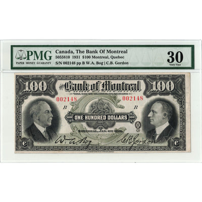 Front face view of a 1931 Bank of Montreal 100 dollar chartered banknote, highlighting the historical design vignettes and PMG VF-30 grading details.