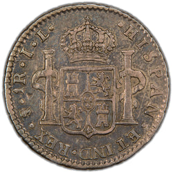 Reverse of a Bolivia 1825 1 Real silver coin (Potosí mint, SKU: SP2901), displaying the crowned shield coat of arms of Castile and León flanked by the Pillars of Hercules wrapped in banners, surrounded by HISPAN ET IND REX with the PTS monogram mintmark, denomination 1R, and assayer initials JL.