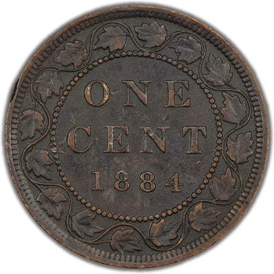 Reverse of a Canada 1884 1 Cent bronze coin (Obverse 1 variety, SKU: SP2834) in Very Fine condition showing minor surface damage, displaying the denomination ONE CENT and date 1884 centered within a maple leaf vine wreath.