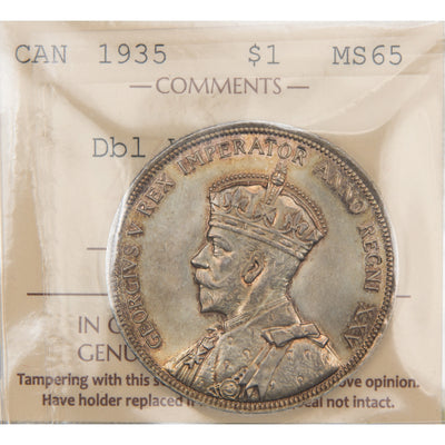 Front of ICCS protective flip holder for a Canada 1935 Double Voyager 1 Dollar silver coin (Grade MS-65, SKU: XXV 906), displaying the official ICCS certification insert with grade, variety designation, and serial number above the coin.