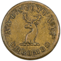Obverse of a Ceylon 1859 A. & B. Scott & Co. Colombo Coffee Store brass 6d token (Pridmore #88, SKU: SP2888), featuring a stag's head facing centered on a scroll, surrounded by the legend A & B. SCOTT & Co. COLOMBO.