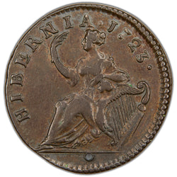Reverse of a holed Ireland 1723 Wood's Hibernia 1/2d Half Penny copper coin (SKU: SP2885), depicting the seated figure of Hibernia resting her left arm on an Irish harp and holding a palm branch in her right hand, surrounded by the legend HIBERNIA . 1723 ., with a hole pierced through the flan.