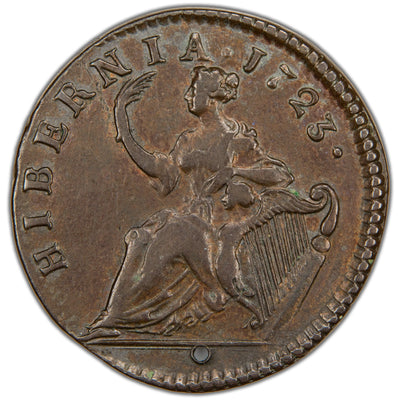 Reverse of a holed Ireland 1723 Wood's Hibernia 1/2d Half Penny copper coin (SKU: SP2885), depicting the seated figure of Hibernia resting her left arm on an Irish harp and holding a palm branch in her right hand, surrounded by the legend HIBERNIA . 1723 ., with a hole pierced through the flan.