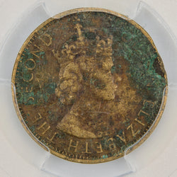 Obverse of a Jamaica 1963 1/2d Halfpenny coin, certified by PCGS as World Trade Center Ground Zero Recovery, featuring the Jamaican national coat of arms with crocodile crest and pineapples on shield flanked by two Taíno figures, surrounded by JAMAICA and HALF PENNY.