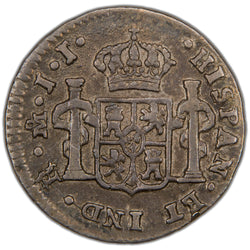 Reverse of a Spanish Colonial Mexico 1815 1/2 Real silver coin (Mexico City mint, SKU: SP2899), displaying the crowned shield coat of arms of Spain flanked by the Pillars of Hercules with PLUS ULTRA ribbons, surrounded by the legend HISPAN ET IND REX with mintmark Mo and assayer initials JJ.