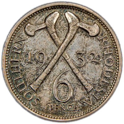 Reverse of a Southern Rhodesia 1932 Sixpence silver coin (SKU: SP2829), depicting two crossed traditional native battle-axes (shona axes/knobkerries), flanked by the date 19 32, with SOUTHERN RHODESIA above and denomination SIXPENCE below.