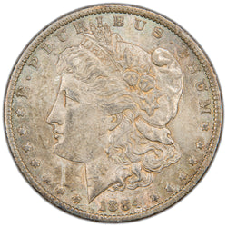 Obverse of a United States 1884-O $1 Morgan silver dollar coin (New Orleans Mint, SKU: SP2882), featuring the left-facing profile bust of Lady Liberty wearing a Phrygian cap decorated with flora and a tiara inscribed LIBERTY, surrounded by 13 stars and the date 1884.