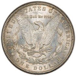 Reverse of a United States 1885 $1 Morgan silver dollar coin (Philadelphia Mint, SKU: SP2881), depicting an American Bald Eagle with wings spread, holding arrows and an olive branch within a laurel wreath, with the motto IN GOD WE TRUST above.