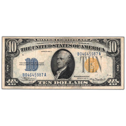 Front of an ungraded United States 1934 $10 North Africa WWII Emergency Issue Silver Certificate note (Fr. #2309, Grade VF, Serial/SKU: B04645987A), featuring a central portrait vignette of Alexander Hamilton, prominent yellow Treasury seal, blue serial number B04645987A, and yellow seal color distinction.