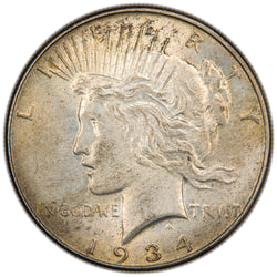 Obverse of a United States 1934 $1 Peace silver dollar coin (Philadelphia Mint, SKU: SP2874), featuring the left-facing profile bust of Lady Liberty wearing a radiant crown, with the motto IN GOD WE TRVST and the date 1934.