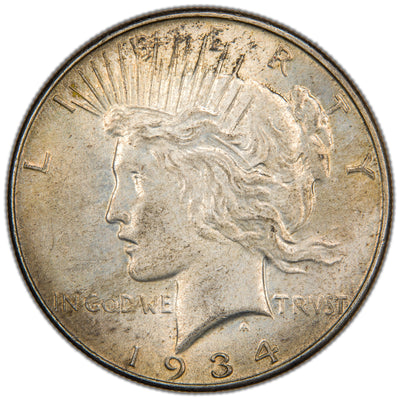 Obverse of a United States 1934 $1 Peace silver dollar coin (Philadelphia Mint, SKU: SP2874), featuring the left-facing profile bust of Lady Liberty wearing a radiant crown, with the motto IN GOD WE TRVST and the date 1934.