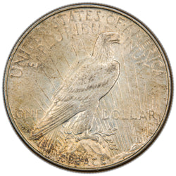 Reverse of a United States 1934 $1 Peace silver dollar coin (Philadelphia Mint, SKU: SP2874), depicting an American Bald Eagle perched on a rock cliff holding an olive branch against rays of sunlight, with the word PEACE at the base.