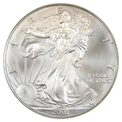 Obverse of a United States 2001 1oz $1 Silver Eagle coin (PCGS Gem UNC, SKU: WTC 060), featuring Adolph A. Weinman's full-length figure of Liberty walking draped in the American flag toward the rising sun, inscribed with LIBERTY, IN GOD WE TRUST, and the date 2001.