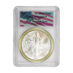 Front of PCGS protective slab encapsulation holder for a United States 2001 1oz $1 Silver Eagle coin (Grade Gem UNC, SKU: WTC 050), displaying the special WTC Ground Zero certification label with PCGS logo, grade, and serial number above the coin.